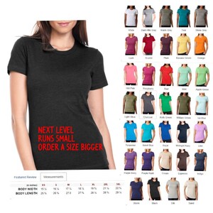 May include: A charcoal grey t-shirt with the text "NEXT LEVEL RUNS SMALL ORDER A SIZE BIGGER" printed on the front. A size chart is included with measurements in inches for XS, S, M, L, XL, 2XL, and 3XL.