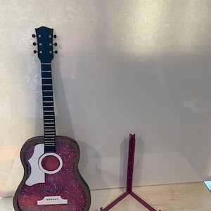 Large guitar piggy bank. Pink inside. Mahogany wood. Base included.music, coin bank. Home decor. Music lover. Handmade, graduation gift