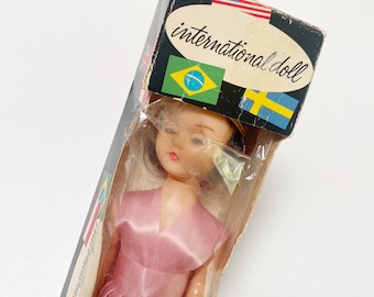 Vintage International Doll - Miss England - Blinking Eyes And Pink Dress