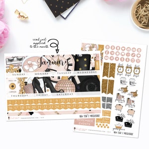 May include: A pink and gold January calendar planner with gold glitter accents. The calendar features a black and white illustration of a clock, a disco ball, and high heels. The planner also includes a set of stickers with gold glitter accents and illustrations of clocks, coffee cups, and books.