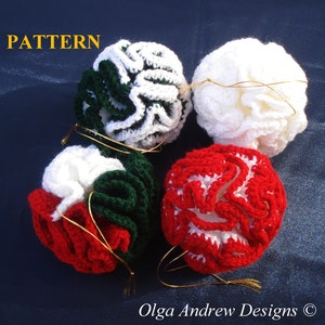 May include: Four crocheted Christmas ornaments in red, white, and green. The ornaments are shaped like flowers and have a ruffled texture.