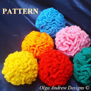 May include: A collection of colorful, crocheted items in shades of yellow, orange, red, blue, pink, and green. The word "PATTERN" is displayed in gold letters at the top of the image. The items are arranged on a dark blue surface.