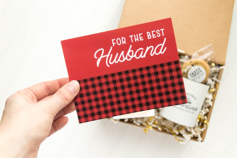 May include: Red and black plaid card with the text "For the Best Husband" in white.