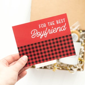 May include: Red card with a black and red plaid pattern at the bottom. The card says "For the Best Boyfriend" in white text.