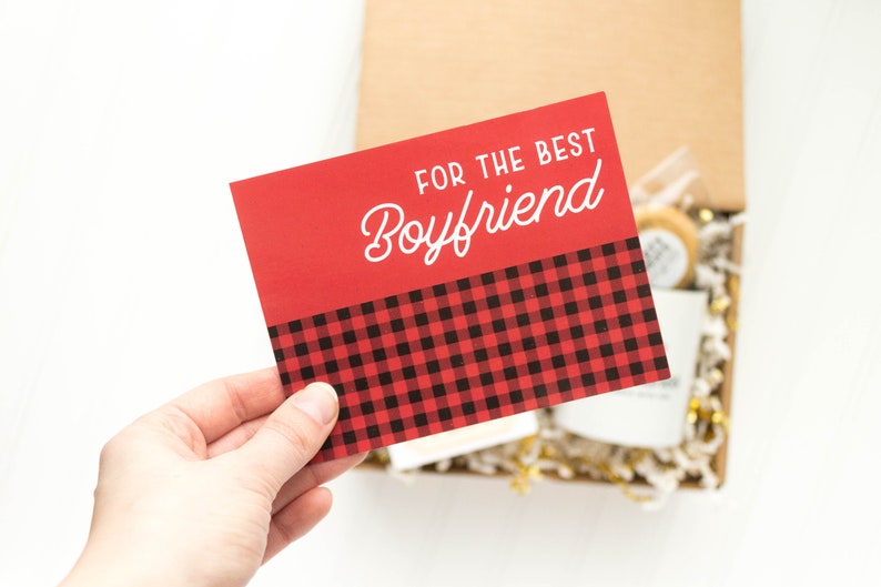 May include: Red card with a black and red plaid pattern at the bottom. The card says "For the Best Boyfriend" in white text.