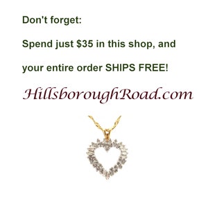 May include: A gold heart-shaped pendant necklace with a diamond-like stone setting. The text "Don't forget: Spend just $35 in this shop, and your entire order SHIPS FREE! HillsboroughRoad.com" is visible in the image.