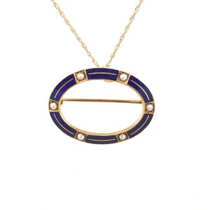 May include: A gold oval pendant necklace with blue enamel and white pearls. The pendant has a bar across the center.