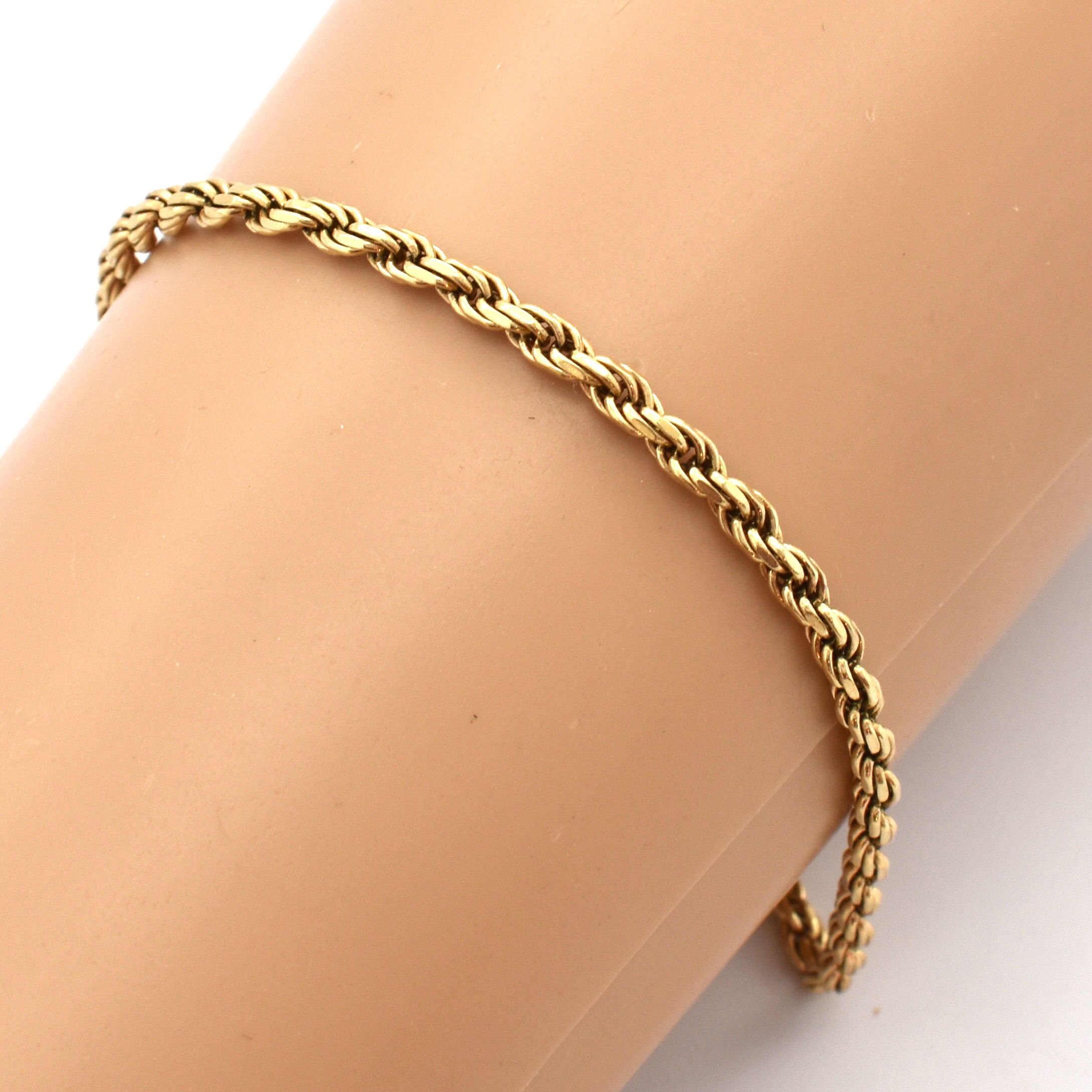 Twisted rope design bracelet in gold and platinum color 