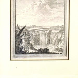 May include: A black and white engraving of Niagara Falls, showing the falls from a distance with a group of people standing on the edge of the cliff. The engraving is framed in a simple black frame.