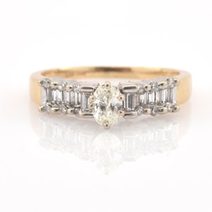 Vintage 14K Gold Oval Diamond Ring with Baguette and Round Accents image 1