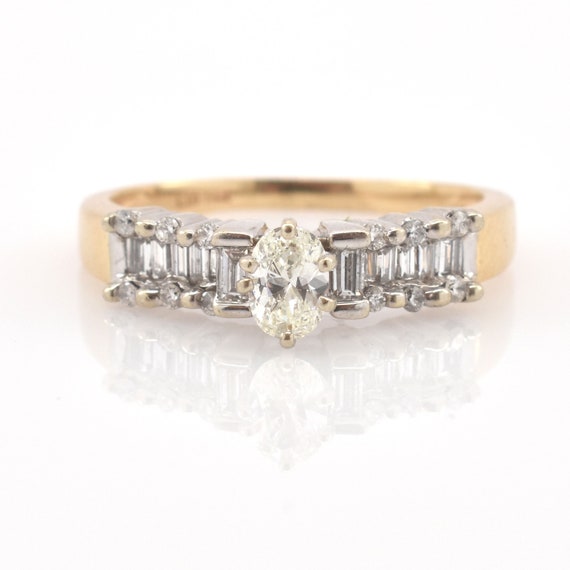 Vintage 14K Gold Oval Diamond Ring with Baguette and Round Accents