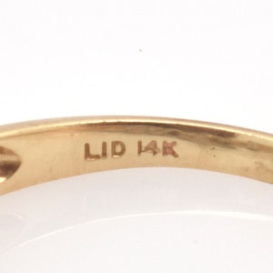 Vintage 14K Gold Oval Diamond Ring with Baguette and Round Accents image 8