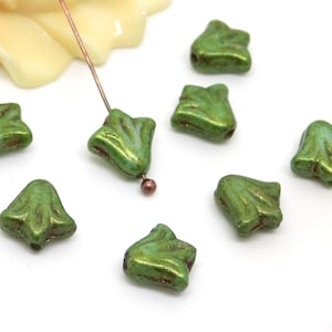 Czech fleur-de-lis beads, pressed glass, green and bronze tones, patina, 9 x 9 mm, set of 10