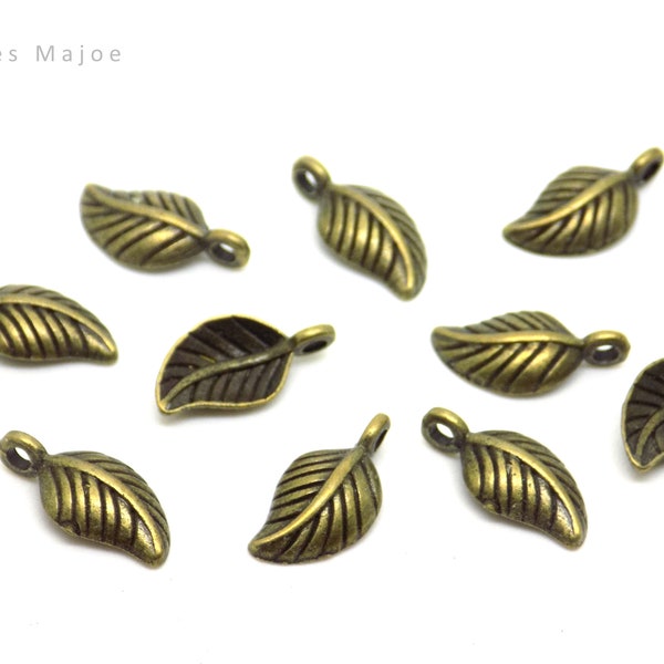 Breloques feuille, style tibétain, couleur bronze antique, 14 x 7 mm, lot de 10