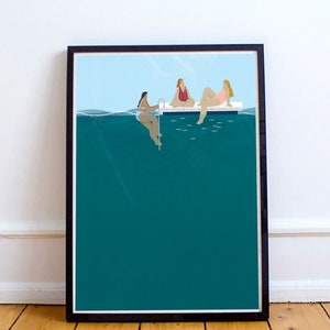 May include: Three women in swimsuits sitting on a floating dock in a teal blue pool. The water level is just below the dock, and the bottom of the pool is visible.