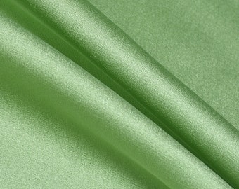 May include: A close-up of a smooth, green fabric with a slight sheen. The fabric is folded in half, and the text "CD614" is printed on the bottom right corner.