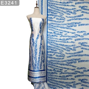 May include: White fabric with a blue floral pattern. The fabric features a repeating design of blue leaves on a white background.
