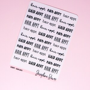 May include: A sheet of clear stickers with the text "HAIR APPT" repeated multiple times in a variety of font styles and sizes. The text "SCRIPT - HAIR APPT" and "Josephine Bow" are also visible on the sheet.
