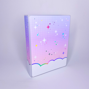 May include: A white binder with a pink, purple, and blue ombre background. The binder has a grid pattern with colorful stars and dots. The bottom of the binder has a white cloud with a rainbow border.