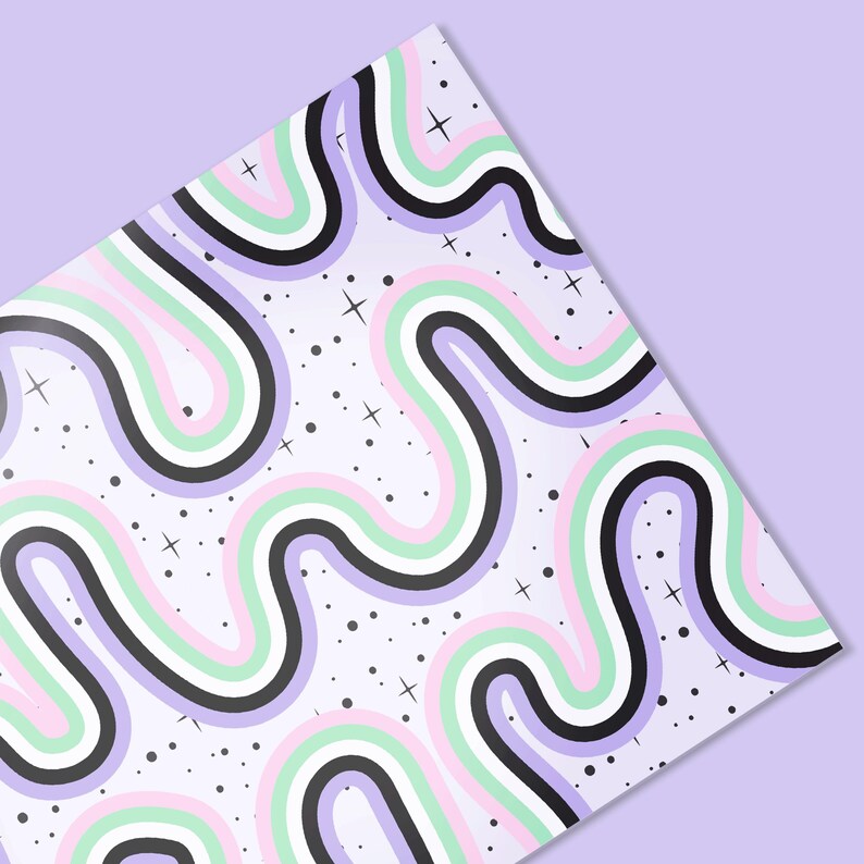 May include: A patterned paper with a repeating design of wavy lines in pastel colors: pink, green, white, and black, on a light purple background. Small black dots and white cross-shaped stars are scattered across the surface.