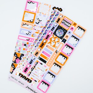 May include: A set of Halloween themed planner stickers featuring a disco ball, ghosts, bats, and dripping black paint. The stickers are on a white background with orange, pink, and purple accents. The text "SPOOKY DISCO - HORROR WEEK" is printed on the bottom of the sticker sheet.