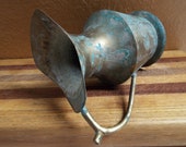 Rustic brass pitcher