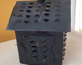 Lantern,  Metal, black color. 5"W x 6"L x 7"H Hut shape.-