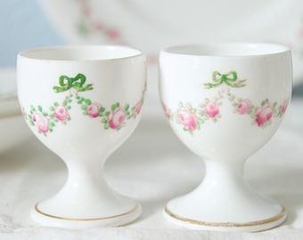 Pair of Hard to Find Antique Crown Staffordshire Egg Cups with Matching Saucers, Hand Painted Pink Rose Garlands and Green Bows, England