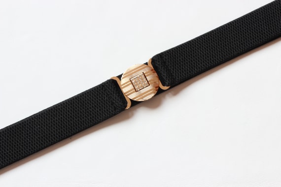 black elastic belt with gold buckle