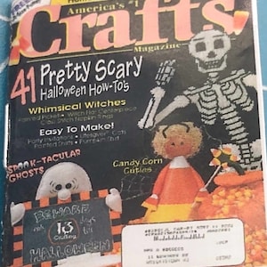 May include: A magazine cover for "Crafts" magazine featuring a skeleton, a ghost, and a candy corn doll. The cover features the text "41 Pretty Scary Halloween How-To's".