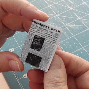 one  Miniature opening  &#39;PRESIDENT KENNEDY&#39; NEWSPAPERS   -  Dollhouse miniature   1/12   scale