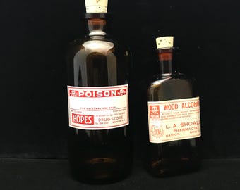 PAIR of vintage poison bottles ( empty )
