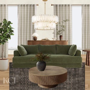May include: A living room interior featuring a sage green sofa, a round fluted wooden coffee table, a two-tier glass chandelier, a dark patterned area rug, a potted fiddle leaf fig plant, and a wooden sideboard with a table lamp.