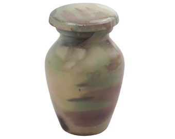 May include: A small, ceramic urn with a lid. The urn is decorated with a mottled, abstract pattern in shades of brown, green, and beige.