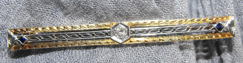 Vintage 14 karat Gold 5.5mm wide. 58mm long Diamond and Sapphire Bar Brooch