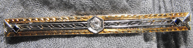 Vintage 14 karat Gold 5.5mm wide. 58mm long Diamond and Sapphire Bar Brooch
