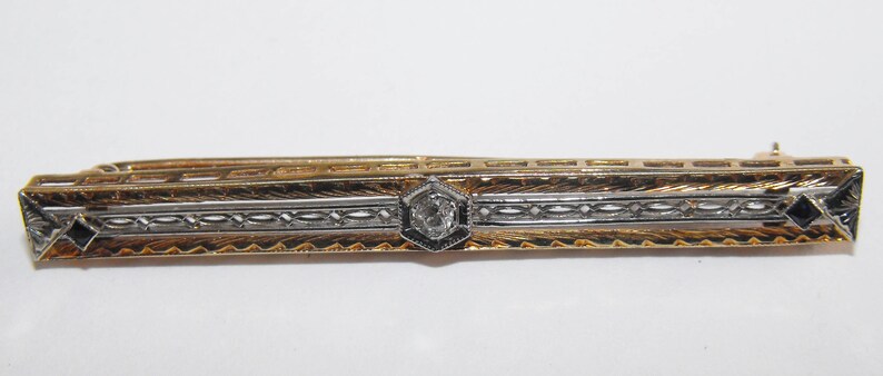Vintage 14 karat Gold 5.5mm wide. 58mm long Diamond and Sapphire Bar Brooch