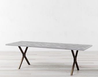 May include: A rectangular gray dining table with a herringbone pattern top. The table has bronze-colored, X-shaped legs. The table is approximately 72 inches long.