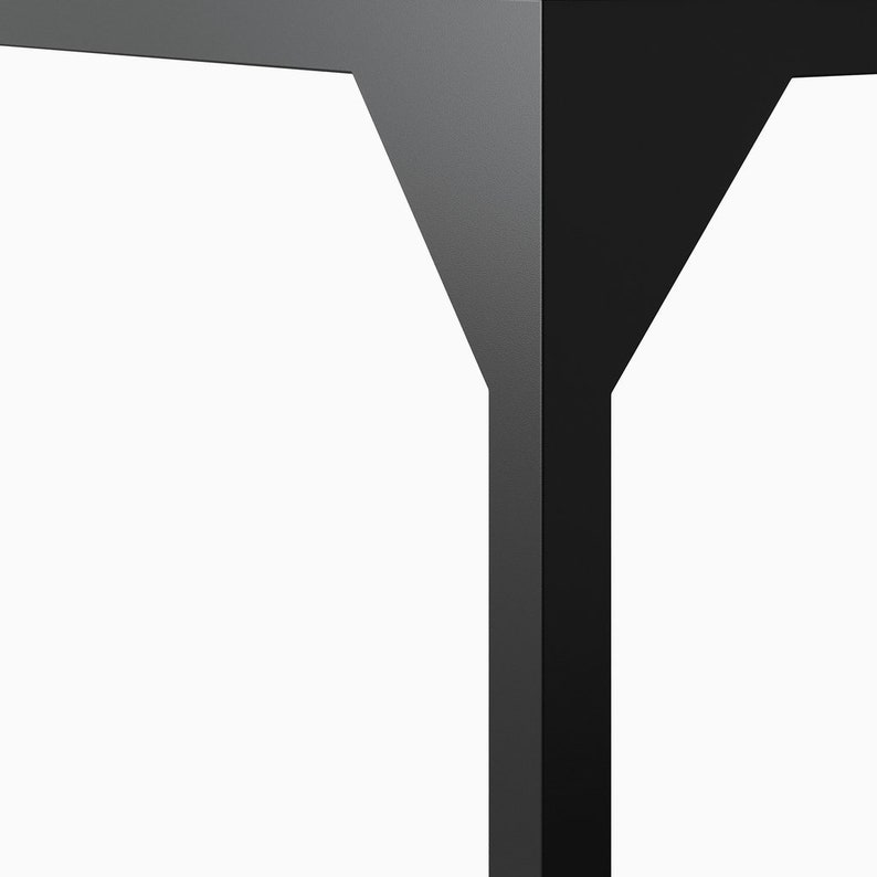 May include: Close-up of a black metal table leg with a unique Y-shaped design. The leg is made of a sturdy, durable material and features a smooth, matte finish.