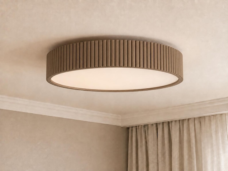 May include: A circular flush mount ceiling light fixture featuring a textured, ribbed brown outer frame and a flat, opaque white diffuser panel that emits a soft, even glow across the surface of the light fixture when illuminated.