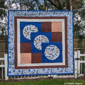 Handmade Modern Art Quilt Wallhanging, Improv Design in Blue and Browns with Circle and Feather Motifs