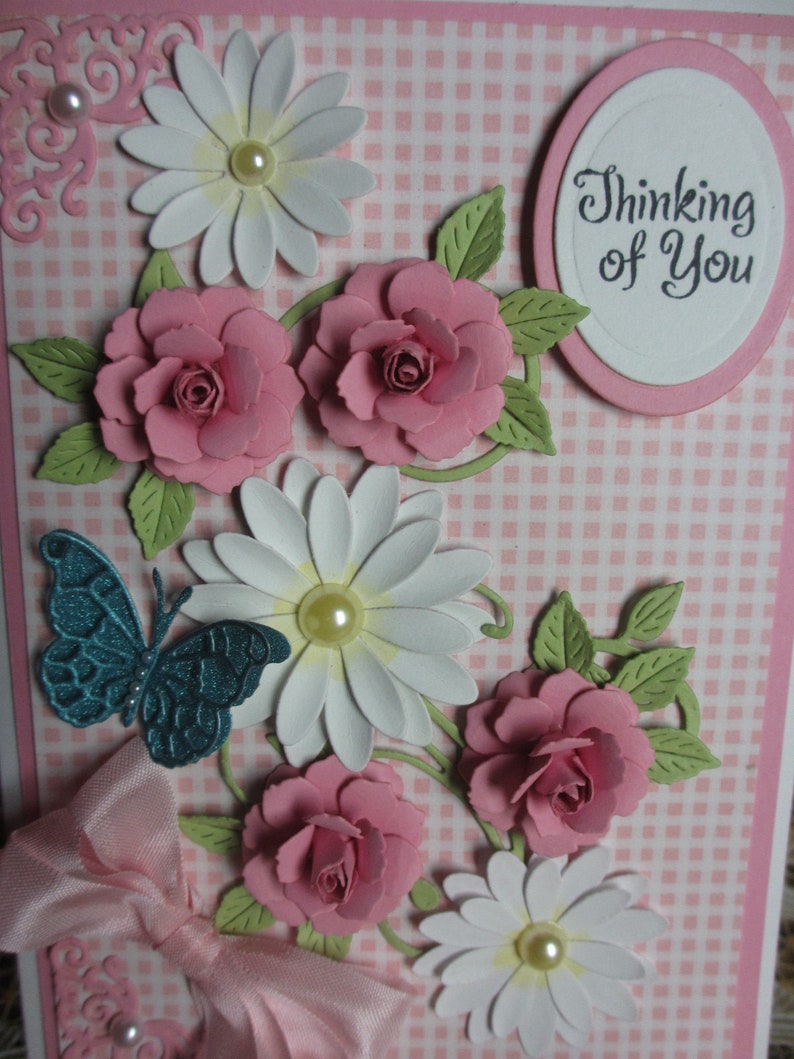 Handmade embellished pink gingham background with pink roses and white daisies thinking of you card with butterfly