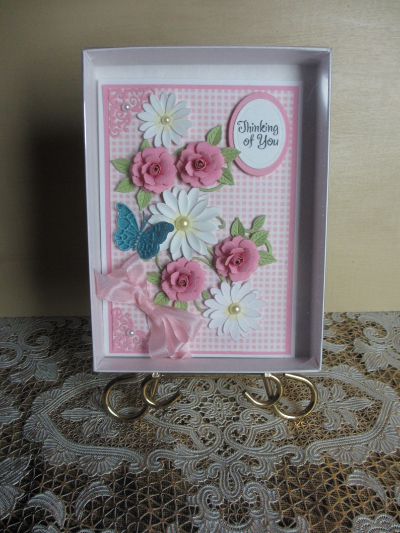 Handmade embellished pink gingham background with pink roses and white daisies thinking of you card with butterfly
