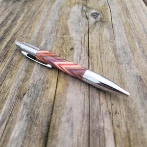 Walnut, cherry, holly, and dyed maple veneers hand turned Click Pen