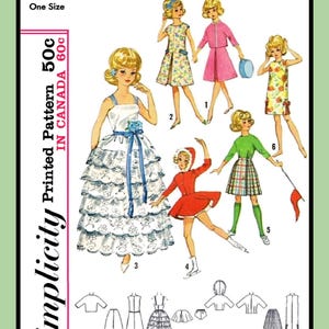 May include: A vintage Simplicity sewing pattern for a doll, featuring six different outfits. The pattern number is 5214 and the price is 50 cents. The outfits include a white dress with a blue sash, a red dress with a white collar, a green sweater with a plaid skirt, a floral dress, a pink dress with a jacket, and a white blouse with a skirt.