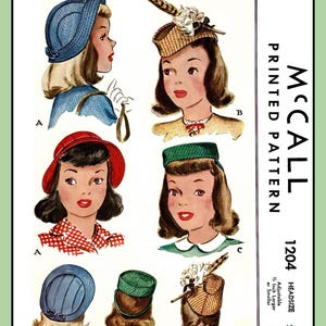 May include: A vintage McCall's sewing pattern for girls' hats. The pattern is for head sizes 22 and includes instructions for making four different styles of hats: a blue cloche hat, a red beret, a green pillbox hat, and a straw hat with a feather.