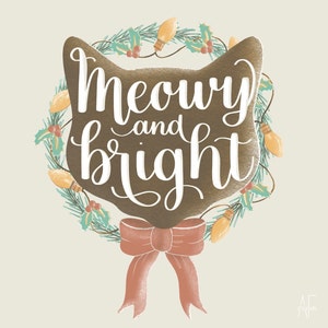 May include: A brown cat-shaped wreath with green leaves, red berries, and gold lights. The wreath has the text "Meowry and bright" written in white.