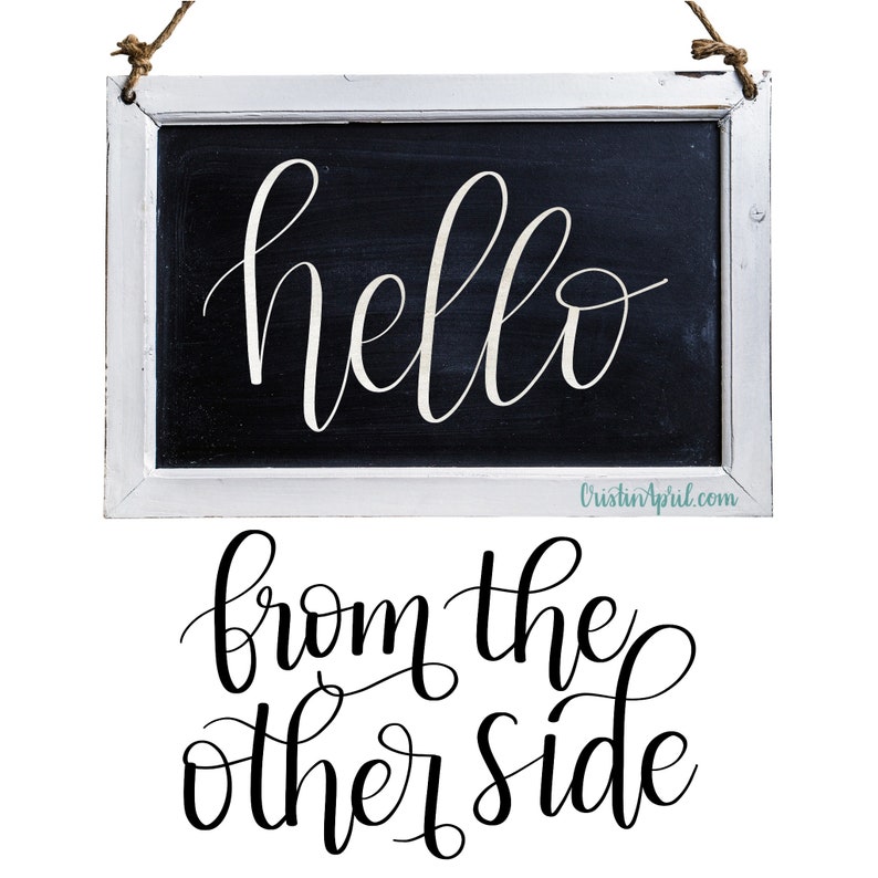 May include: A white framed chalkboard with the text "hello from the other side" written in black cursive script.