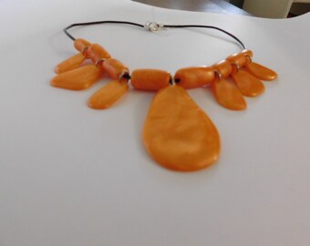 orange handshaped necklace
