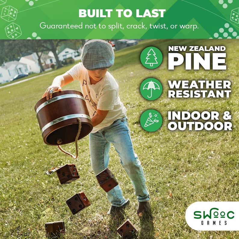 May include: A boy throws wooden dice into a wooden bucket. The dice are brown and have white dots. The bucket is brown with a metal band around the top. The boy is wearing a blue shirt, blue jeans, and a brown hat. The background is a green grassy field. The text on the image reads "BUILT TO LAST", "Guaranteed not to split, crack, twist, or warp.", "NEW ZEALAND PINE", "WEATHER RESISTANT", "INDOOR & OUTDOOR", and "SWOOC GAMES".